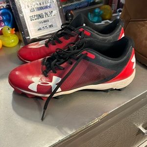 Size 8 Under Armor cleats Red and Black. Show some wear.